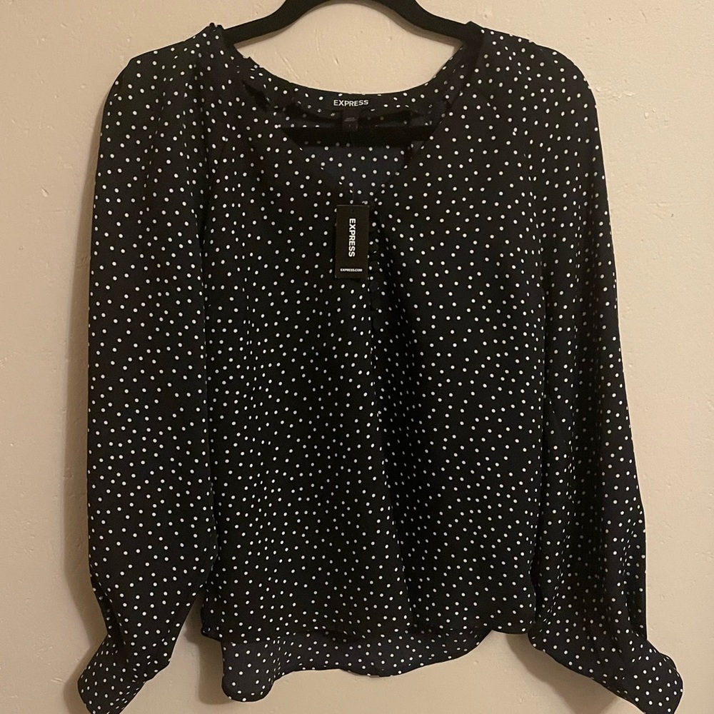 Long sleeve blouse with white small dots.